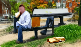 sad man sitting on a bench eating a sandwich.png